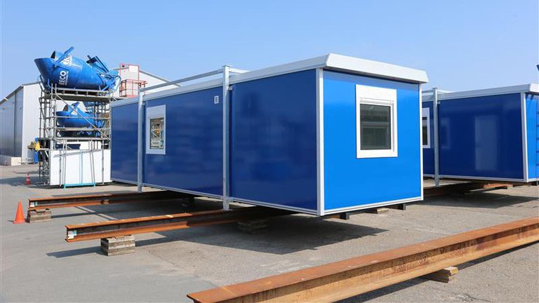 Vrijstaande bouwkeet huren  achterkant